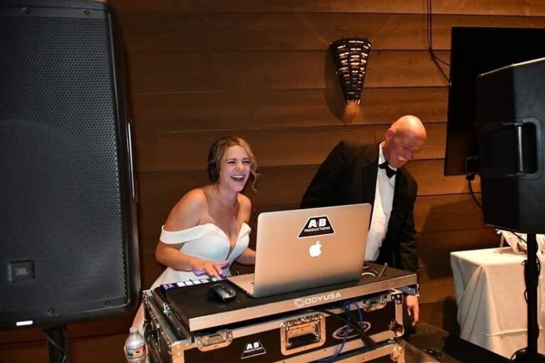 Professional DJ setup at A & B Productions with two DJs enjoying the event.