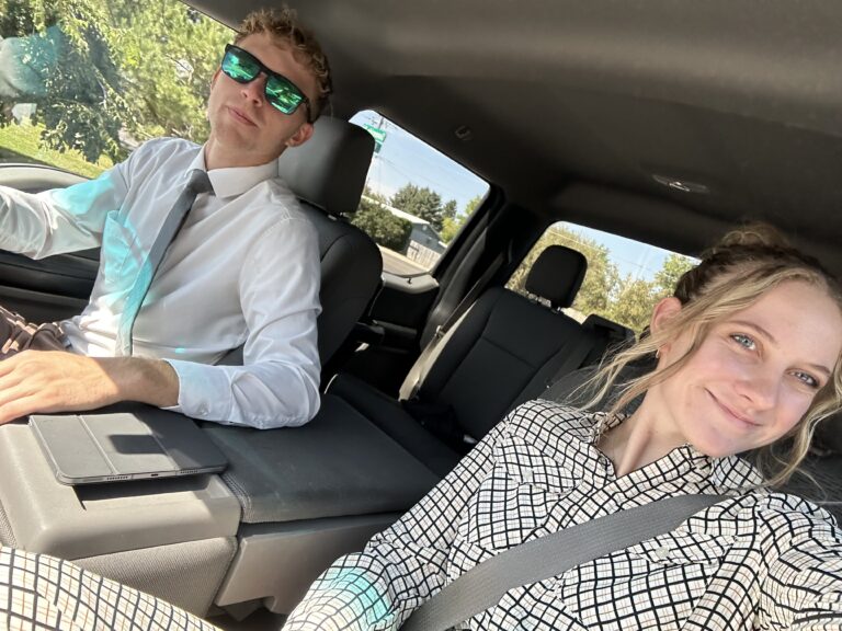 Young adults enjoying a ride in a car, showcasing professional event production services.