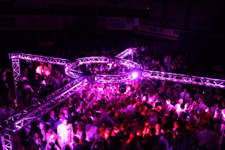 A & B Productions professional event lighting and DJ setup at a lively party.