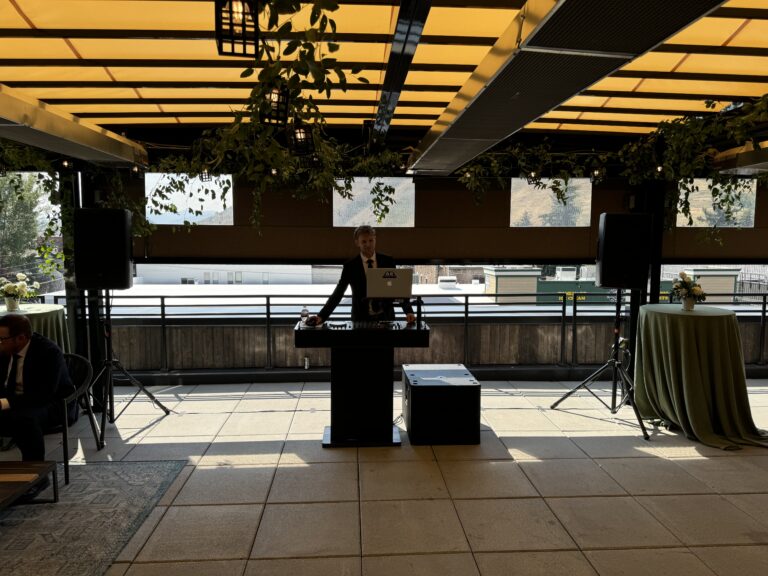 A & B Productions professional event DJ and sound system setup at a modern indoor venue.