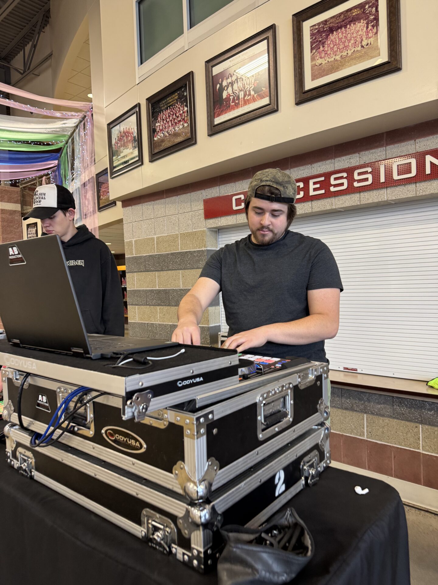 DJ performing at event with professional equipment and sound system.
