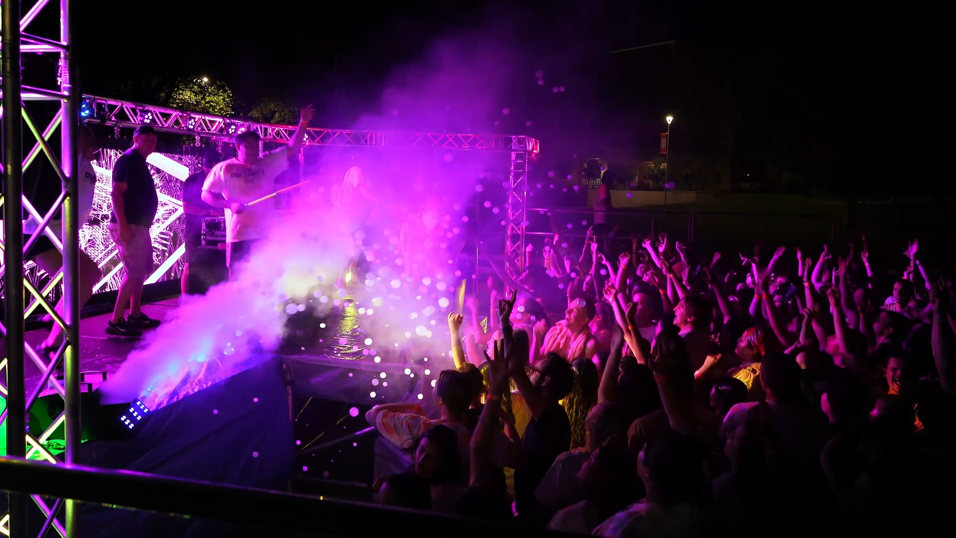 College party crowd under purple stage lights and fog at an A&B Productions dance